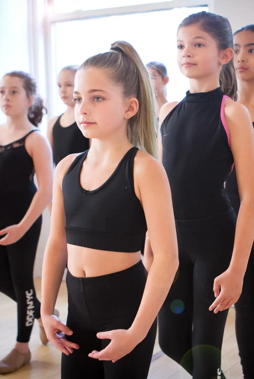 jazz dancers dressed in black preparing to dance