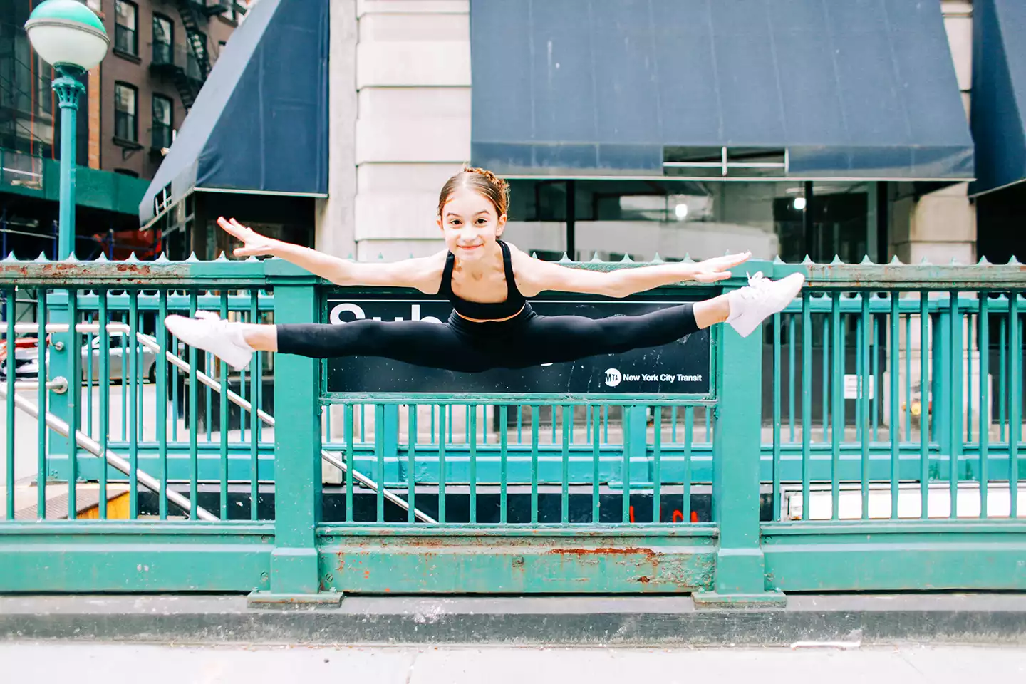 Jumping for joy by the subway station near our downtown Manhattan home!